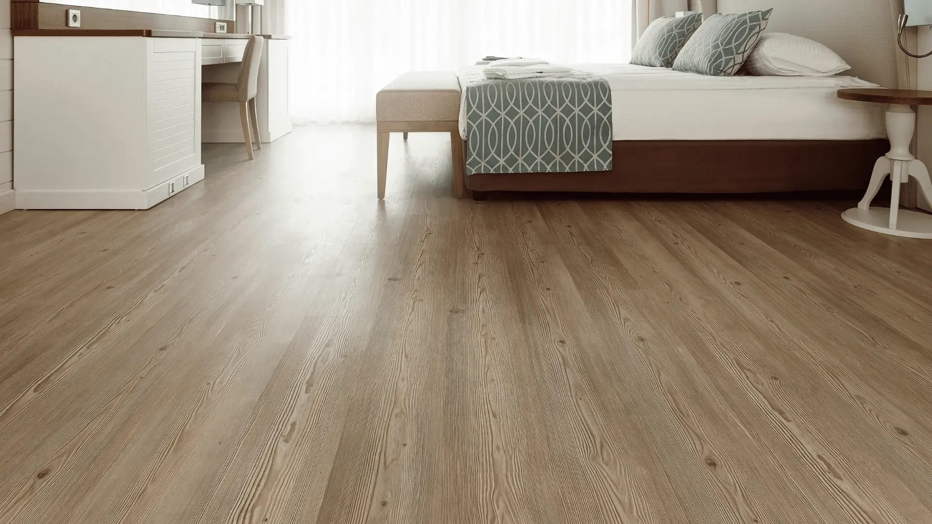 Wide-plank engineered oak flooring in a bright Phoenix metro bedroom