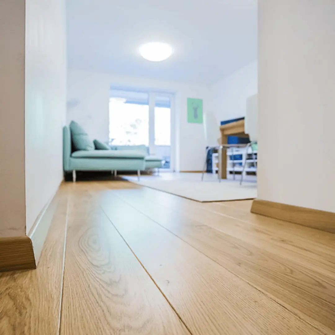Standard engineered oak plank flooring in a bright living room