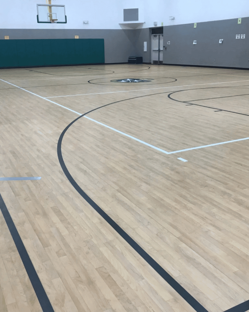 sand and refinish commercial gym flooring basketball court