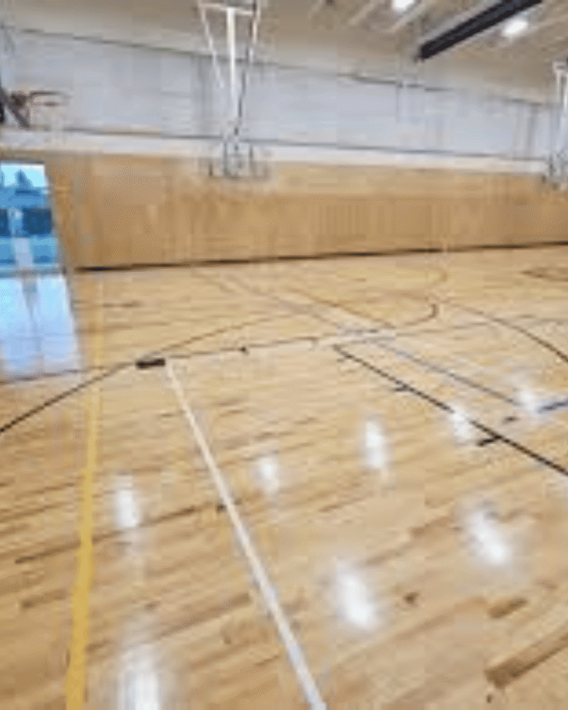 sand and refinish commercial gym flooring basketball court