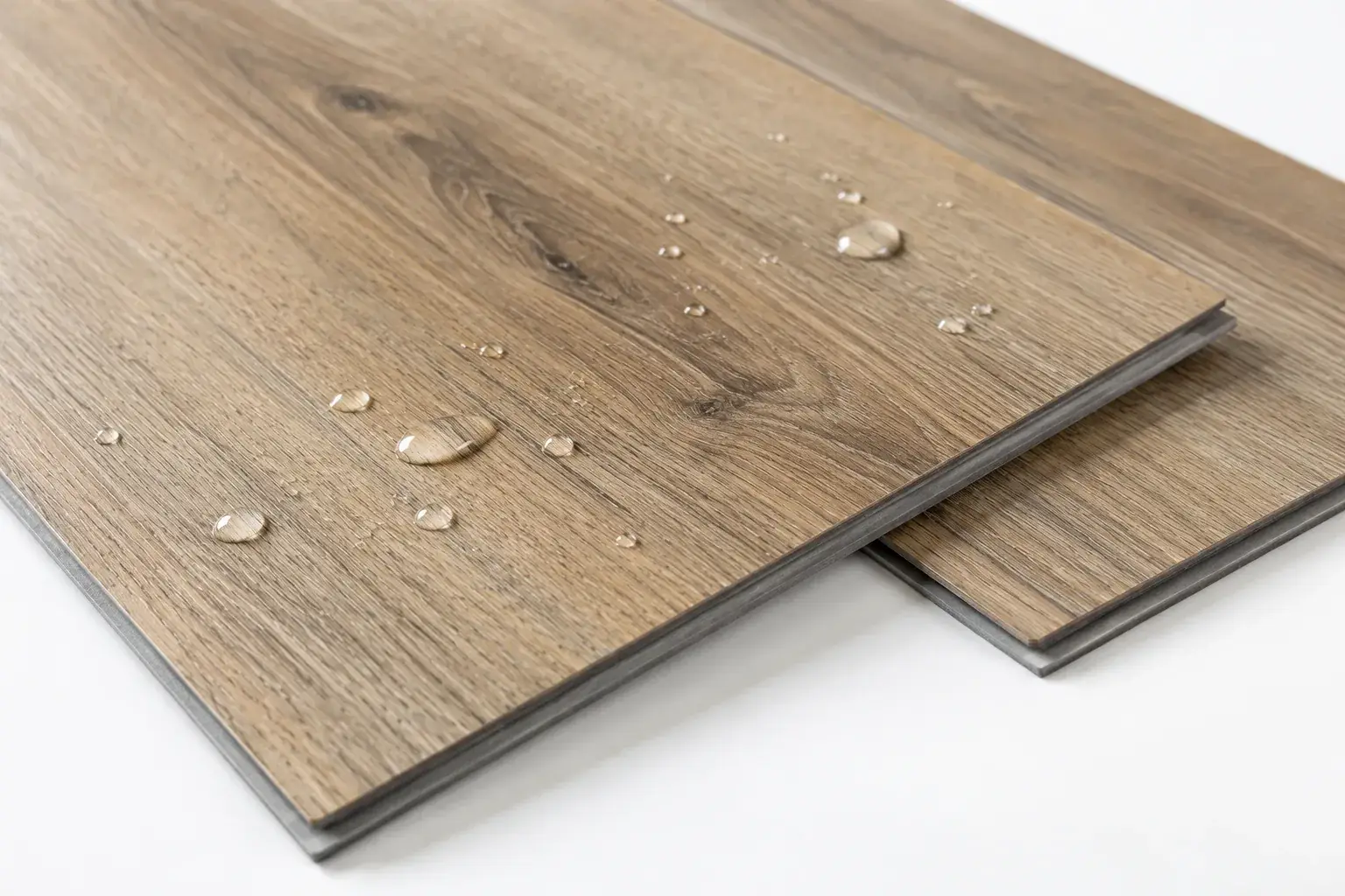 Waterproof vinyl plank sample with water beading on the surface